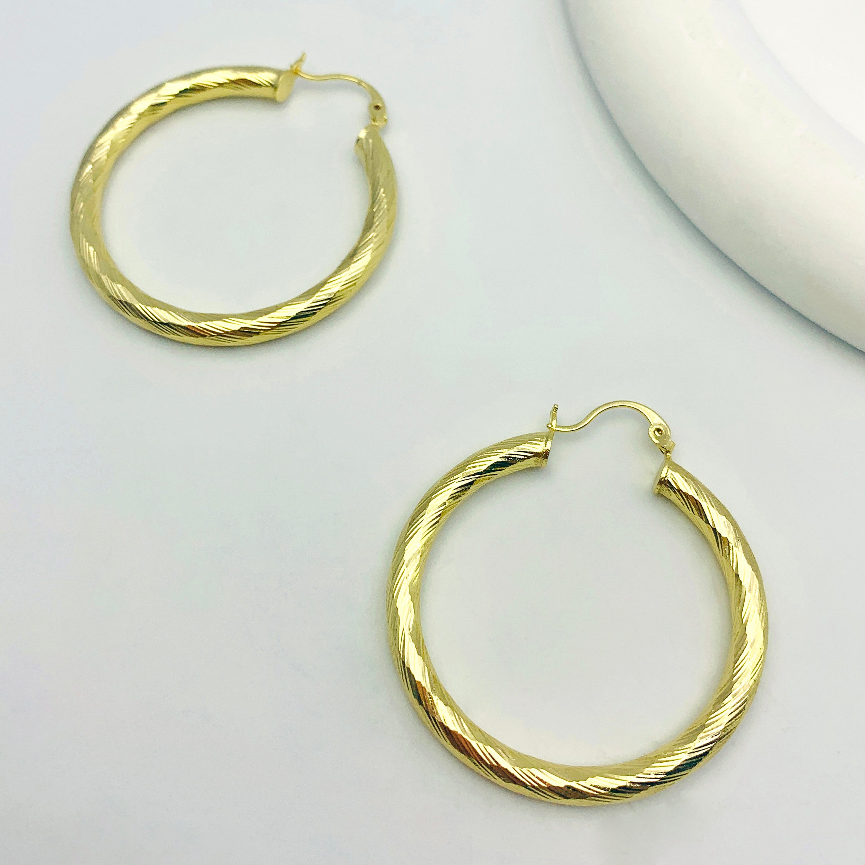 Pendientes de enhebrador divino