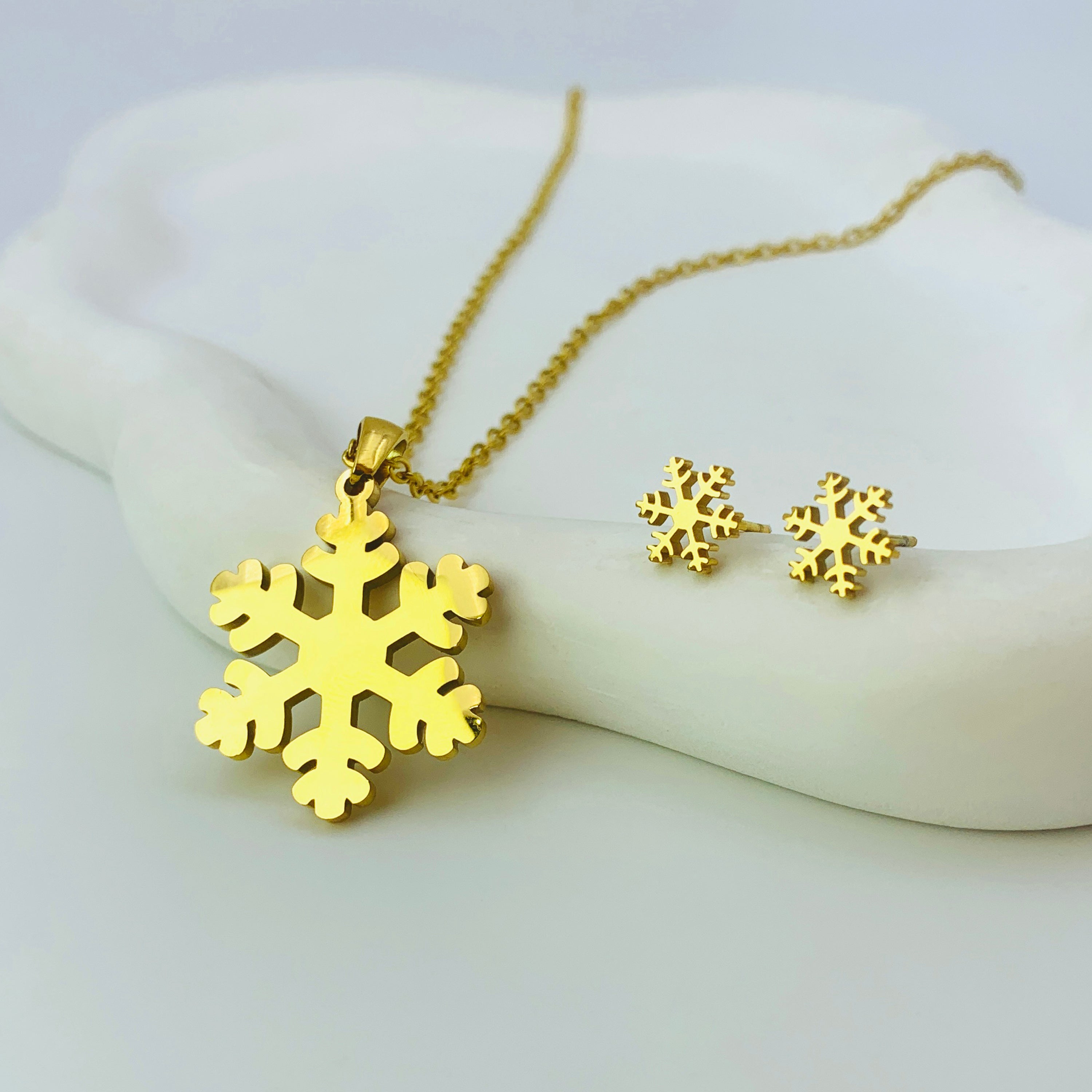 Conjunto de collar y aretes de copo de nieve